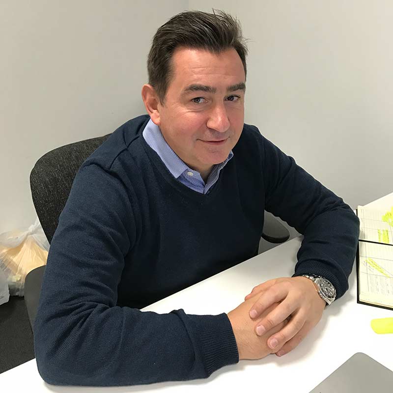 Lee Chapman, founder of Affina Search, at his desk